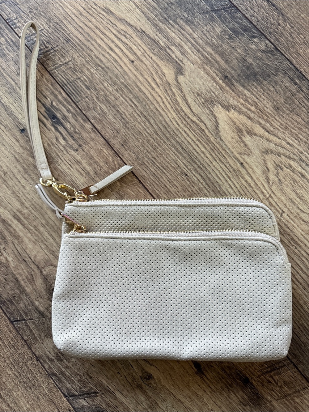 Universal Thread Perforated Cream Wristlet Clutch with Gold Hardware